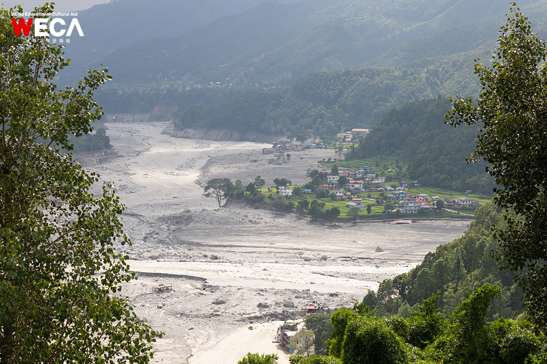 Houses and roads disappeared without trace due to major floods A panoramic view of the ruined Rasu and Uttagarye flood sites in Nepal