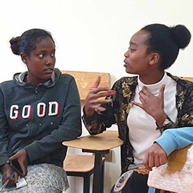 Students discussing With Home with the Ethiopian Pavilion